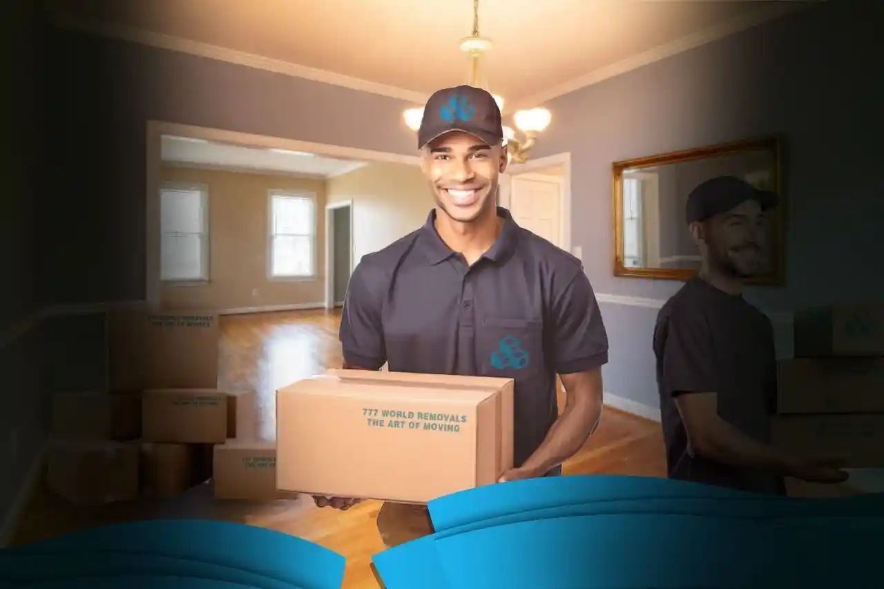 A uniformed 777 World Removals mover carrying a box into a home